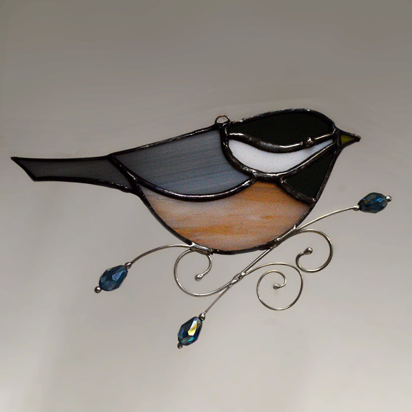 This adorable chickadee stained glass suncatcher is a great for window decoration, as a gift and more! Hang it up in your window to see the full beauty of the stained glass, add it to a floral arraignment, or use it as a gift for the nature lover in your life. All stained glass is handmade by Deb's Broken glass in Bathurst NB.