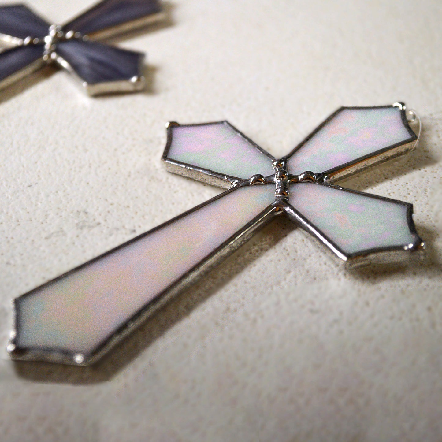 This beautiful cross suncatcher hangs perfectly in any window, and will brighten up your living space! Great for commemoration, as a communion gift, and more! It would also make a great gift great addition to any floral arrangement! All stained glass is handmade by Deb's Broken glass in Bathurst NB.
