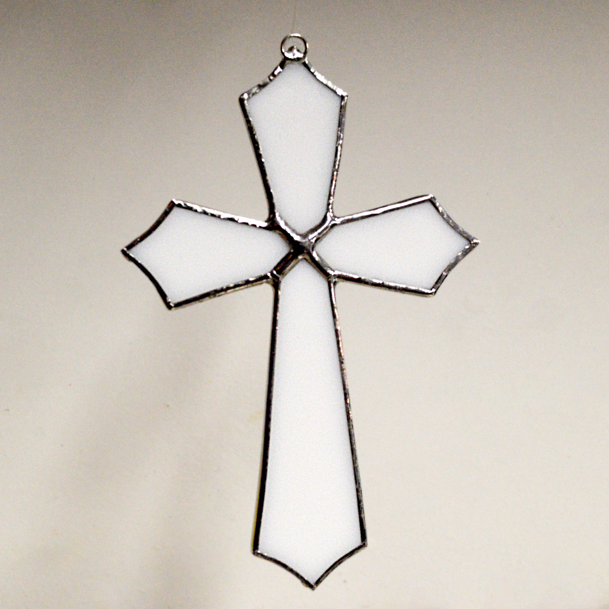 This beautiful cross suncatcher hangs perfectly in any window, and will brighten up your living space! Great for commemoration, as a communion gift, and more!  It would also make a great gift great addition to any floral arrangement!    All stained glass is handmade by Deb's Broken glass in Bathurst NB.