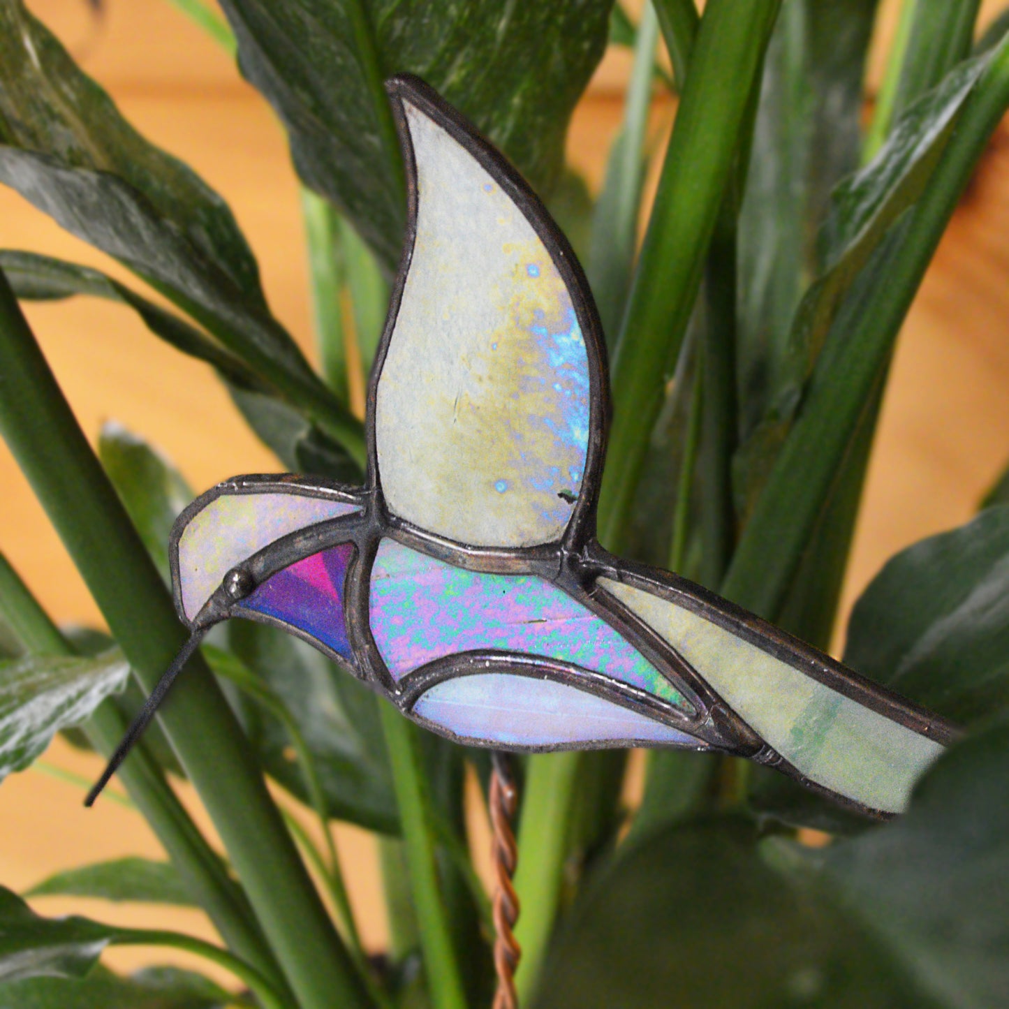 Adorable stained glass hummingbird. Locally made and a great gift for all plant lovers!