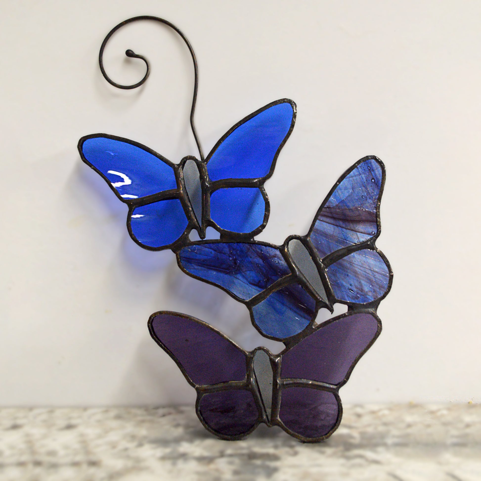 This beautiful butterfly suncatcher hangs perfectly in any window, and will brighten up your living space! It would also make a great gift great addition to any floral arrangement!    All stained glass is handmade by Deb's Broken glass in Bathurst NB.   