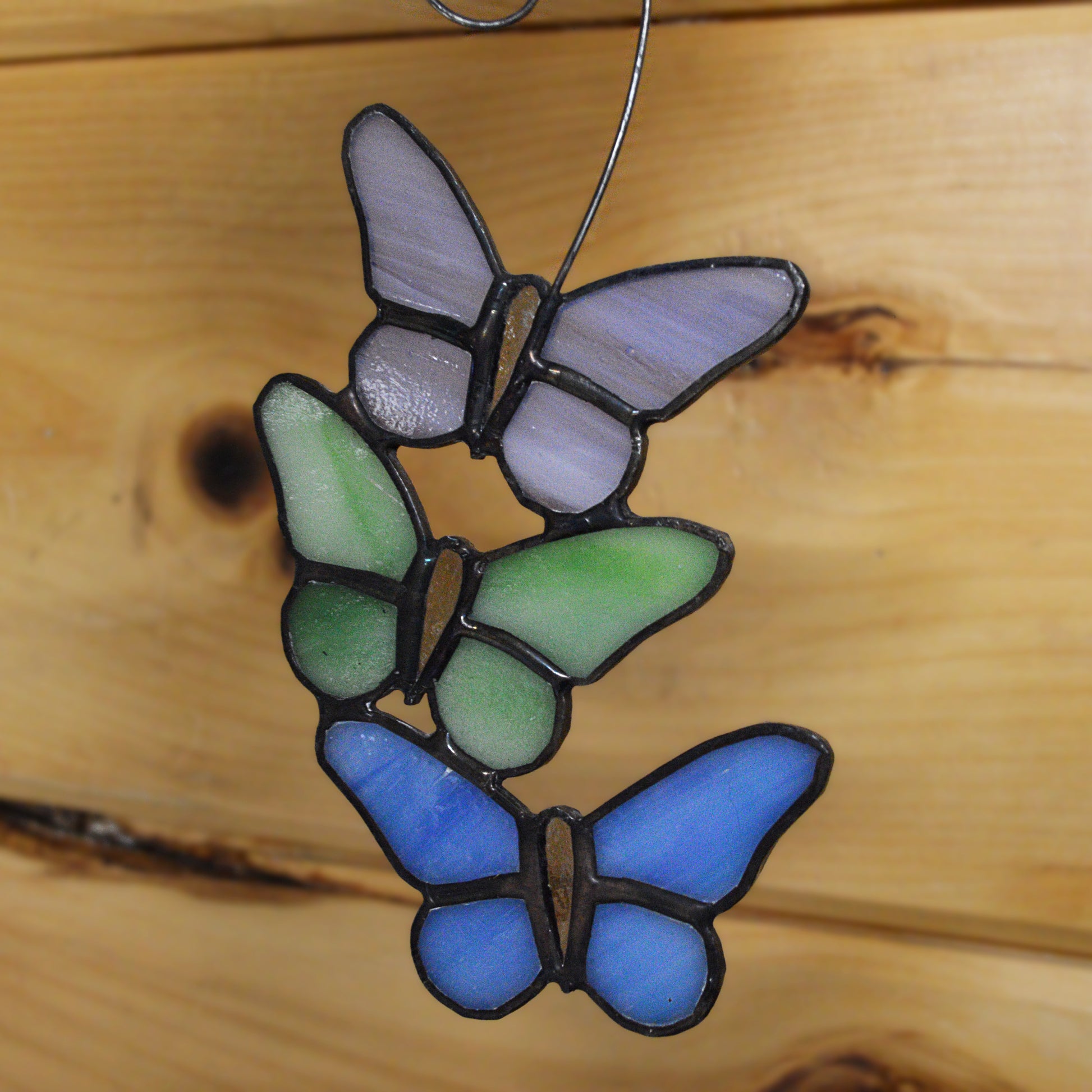 This beautiful butterfly suncatcher hangs perfectly in any window, and will brighten up your living space! It would also make a great gift great addition to any floral arrangement!    All stained glass is handmade by Deb's Broken glass in Bathurst NB.   