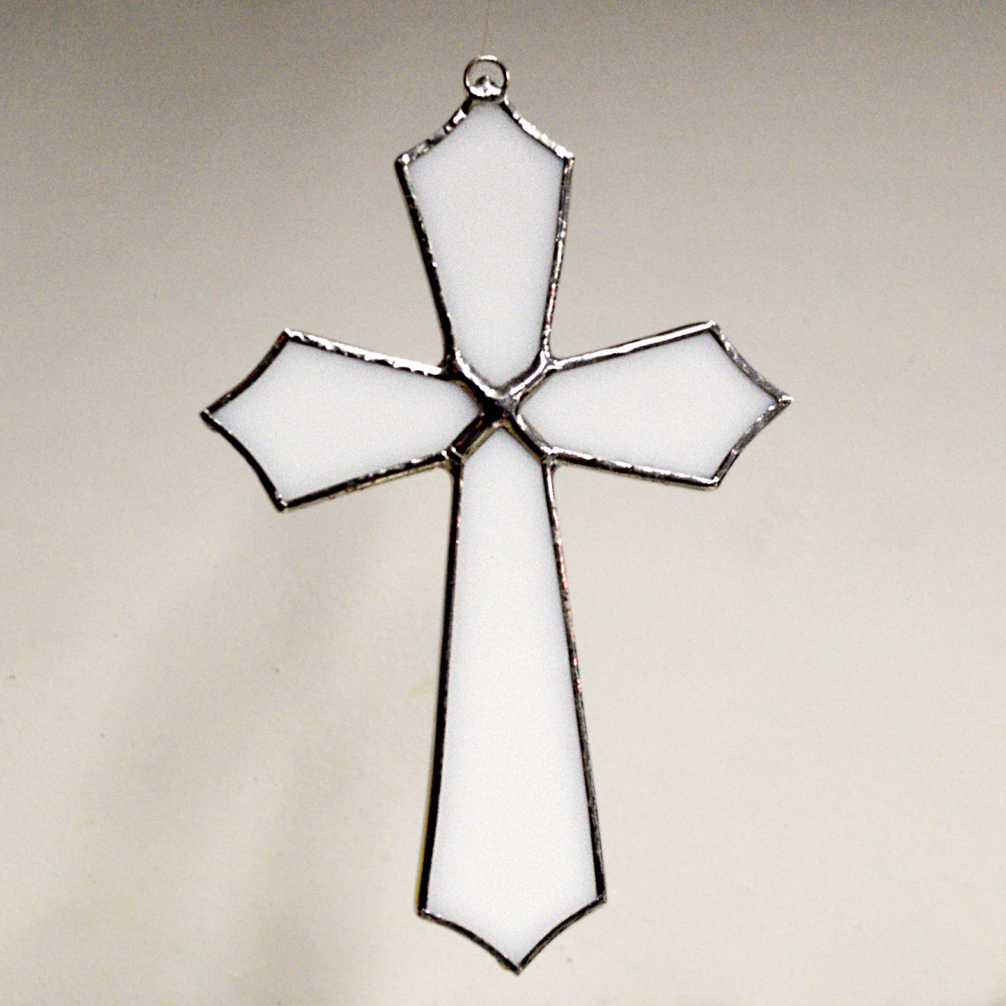 This beautiful cross suncatcher hangs perfectly in any window, and will brighten up your living space! Great for commemoration, as a communion gift, and more!  It would also make a great gift great addition to any floral arrangement!    All stained glass is handmade by Deb's Broken glass in Bathurst NB.   