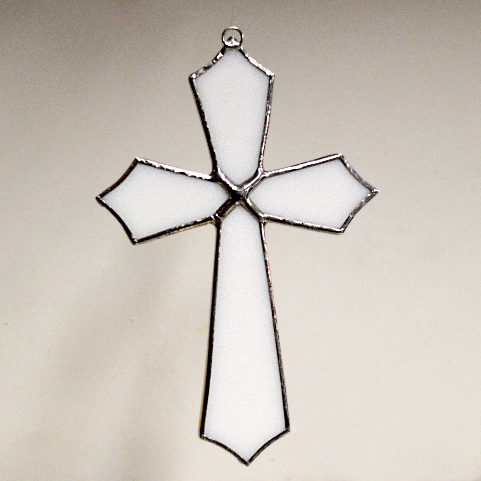 This beautiful cross suncatcher hangs perfectly in any window, and will brighten up your living space! Great for commemoration, as a communion gift, and more!  It would also make a great gift great addition to any floral arrangement!    All stained glass is handmade by Deb's Broken glass in Bathurst NB.   
