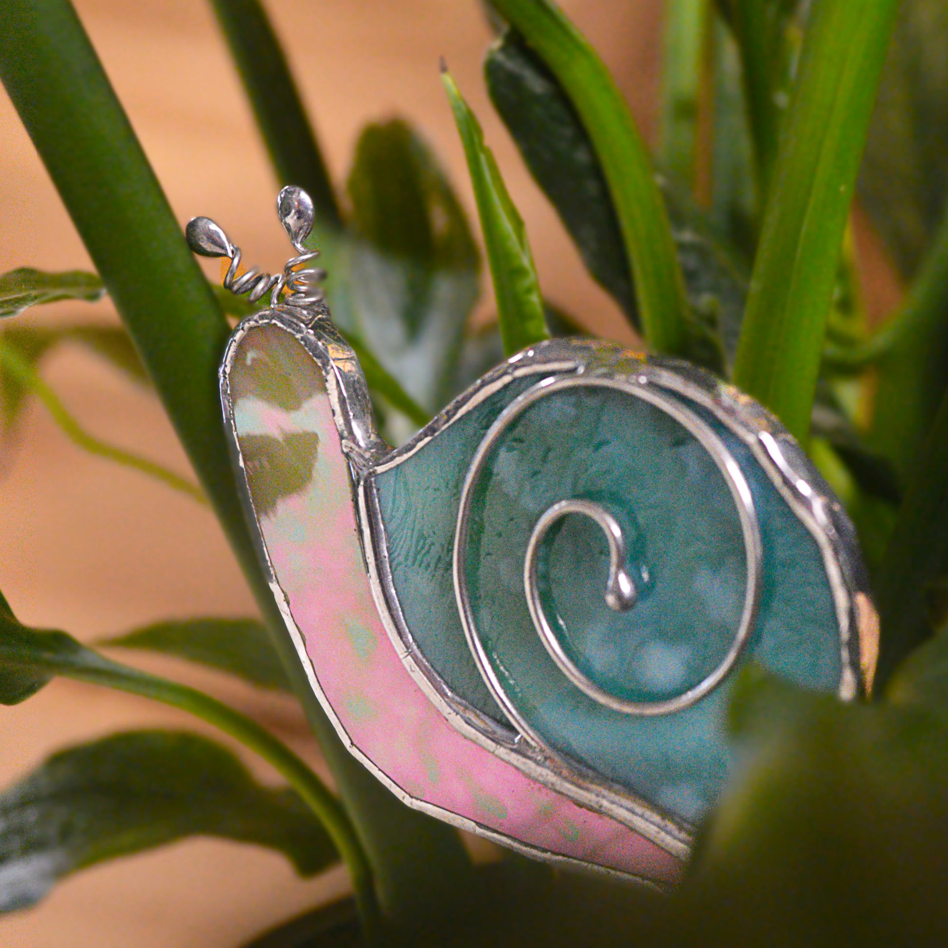 Adorable stained glass snail. Locally made and a great gift for all plant lovers!